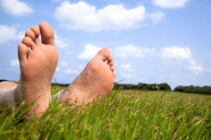Earthing - bare feet on the grass
